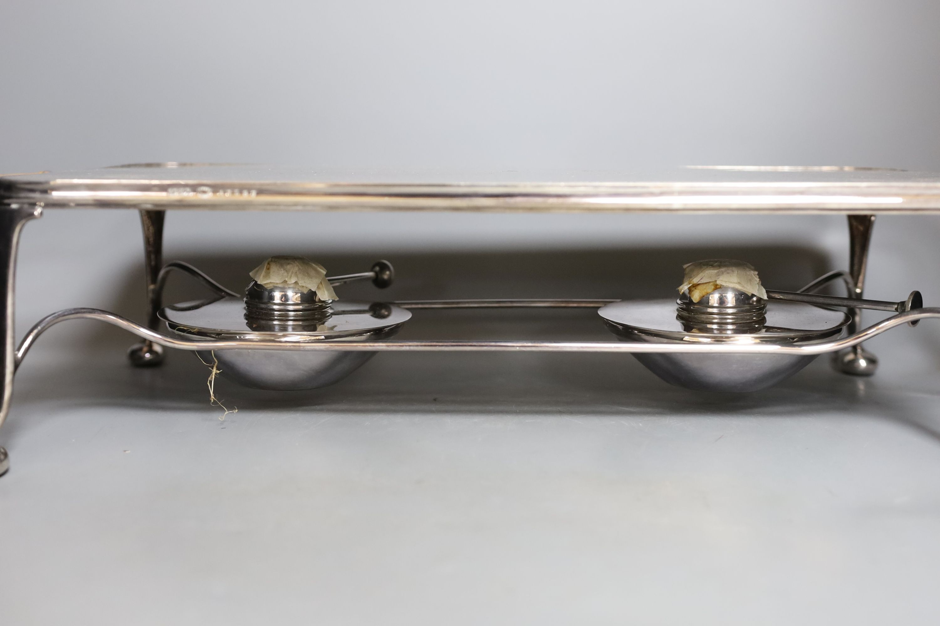 An Asprey two handled hot plate and a double gourd shaped soda stream, 50 cms high.